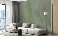 Green watercolor mural with artistic depth
