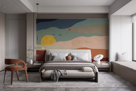 Abstract Sunrise mural of layered hills, yellow sun and birds in terracotta tones above an upholstered bedroom bed
