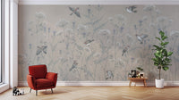 Enchanted Aviary Ballet mural with sparrows and white blossoms behind a red accent chair in a living room