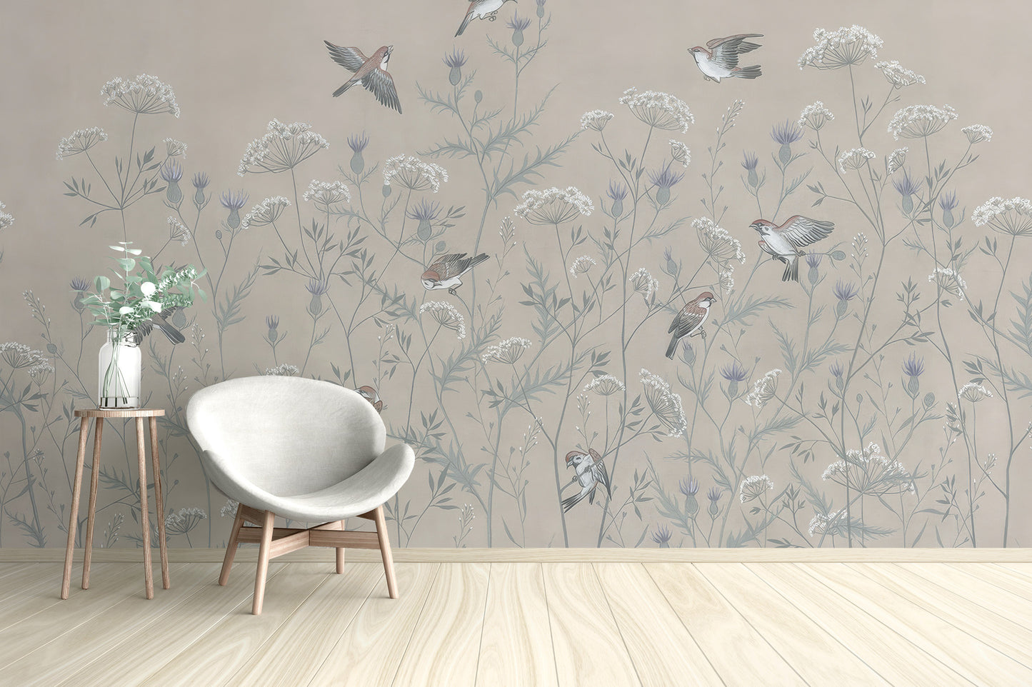 Enchanted Aviary Ballet mural of beige wildflowers and birds behind a white egg chair in a living room