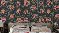 Blooming Elegance Floral wallpaper of coral tulips and green leaves on a navy background behind a beige headboard in a bedroom