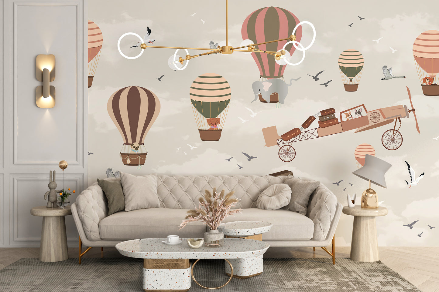 Whimsical Sky High Adventure wallpaper mural with pastel balloons and a flying plane behind a beige tufted sofa in a living room