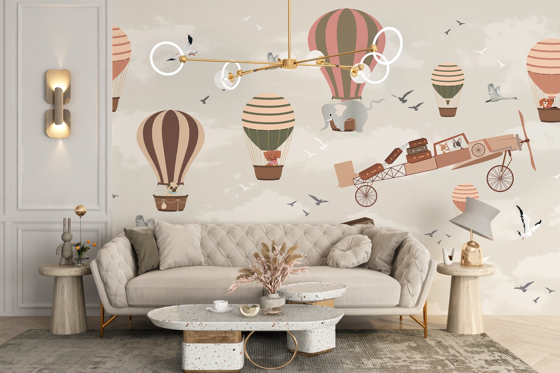 Whimsical Sky High Adventure wallpaper mural with pastel balloons and a flying plane behind a beige tufted sofa in a living room