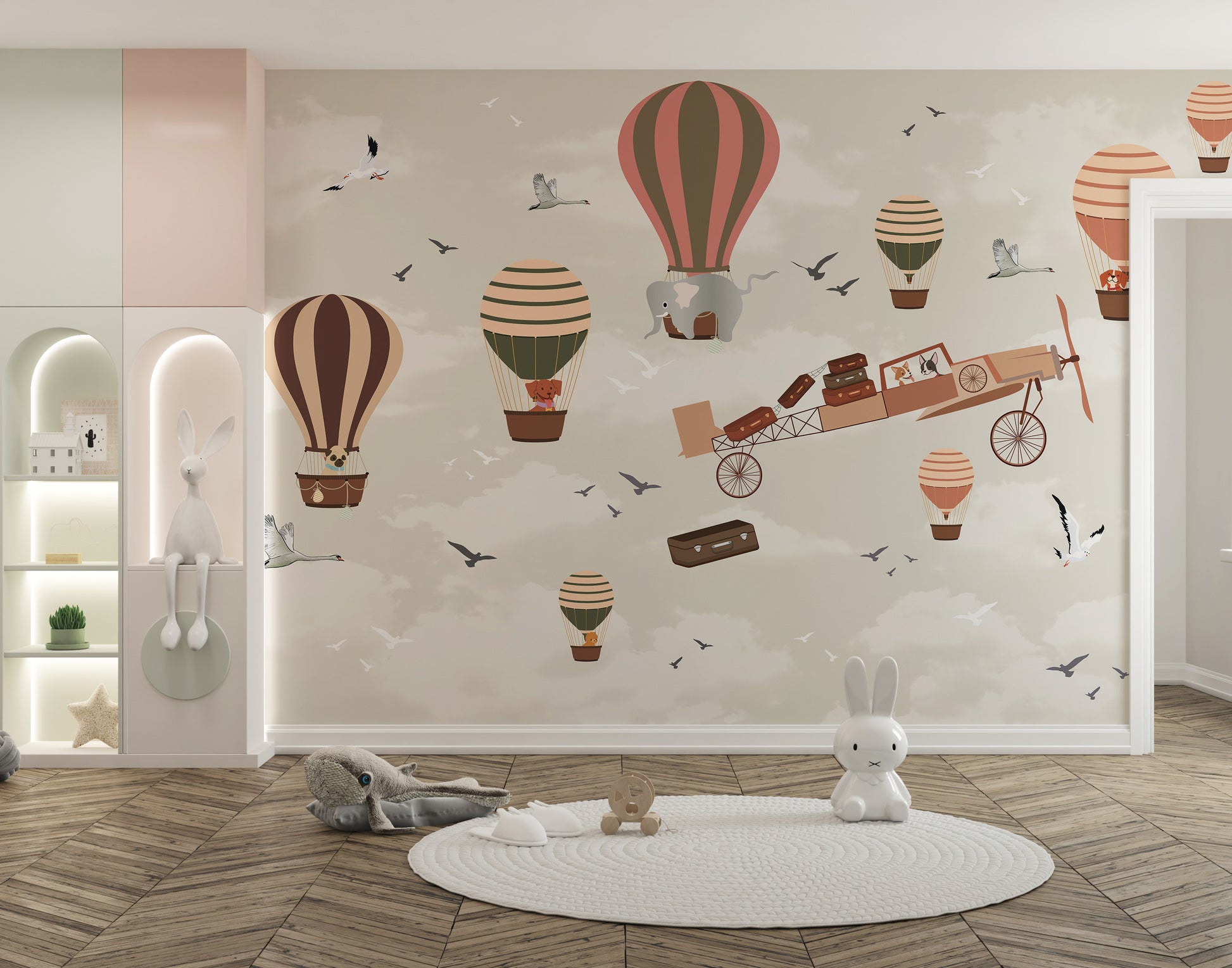 Whimsical Sky High Adventure wallpaper mural of hot air balloons, an elephant and vintage plane in a kids nursery with knit rug and toys