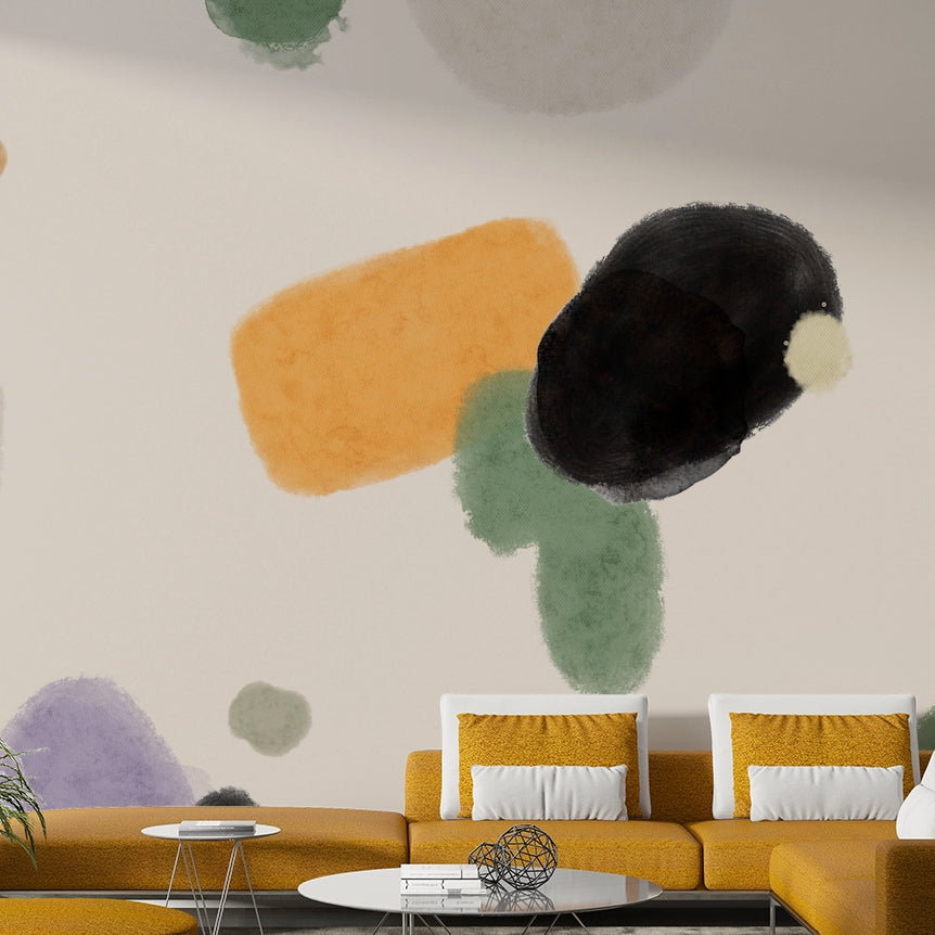 Clam Tone Composition wallpaper mural with orange and green watercolor blobs behind a mustard-yellow sofa in a living room