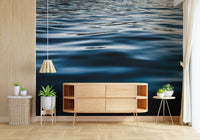 Wall mural with realistic water textures and gradient blue tones creating a calming aquatic ambiance.