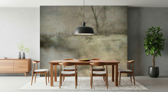 Ethereal Field wallpaper mural of a misty grassland and bare tree behind a wood dining table with a black dome pendant