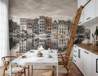 Canal Harmony wallpaper mural of Amsterdam canal houses behind a white marble table and wishbone chairs in a kitchen