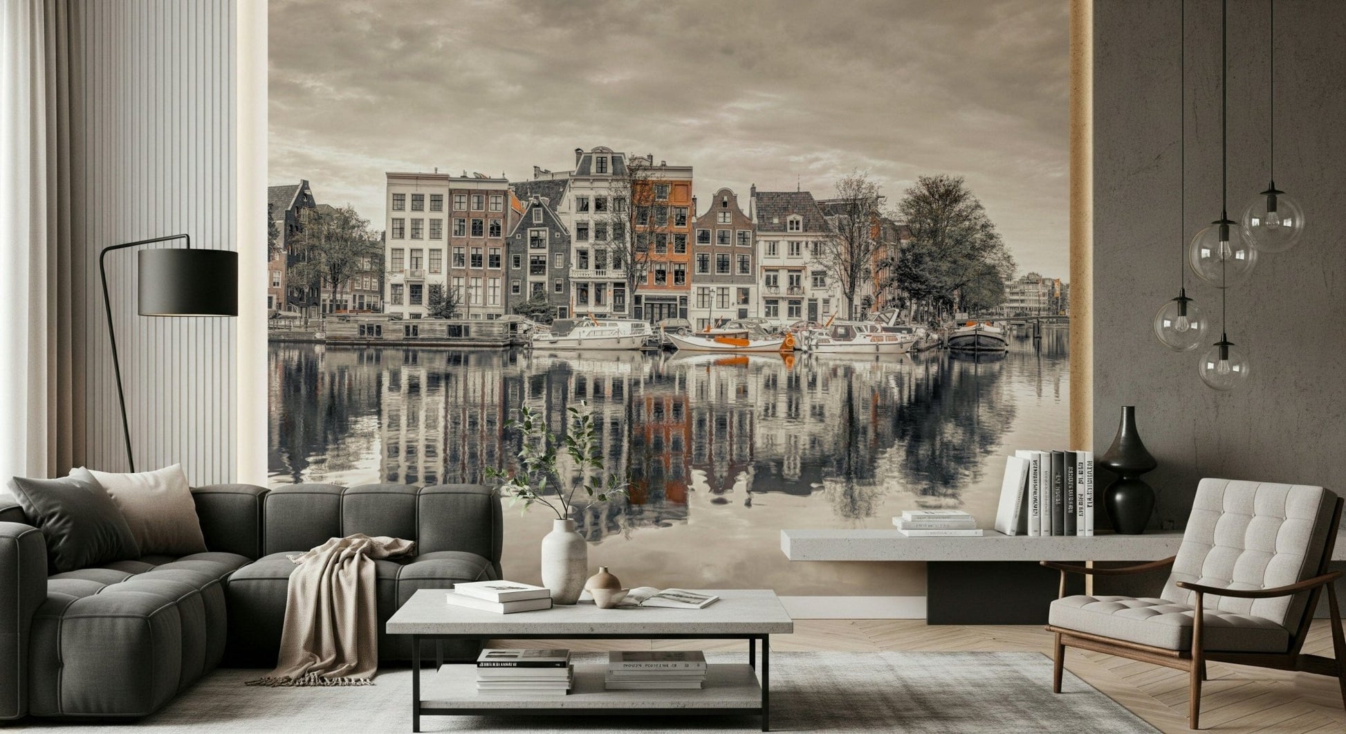 Canal Harmony wallpaper mural of gabled canal houses and boats behind a dark gray sofa and white tufted chair in a lounge