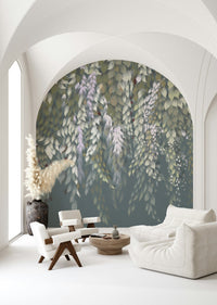 Cascading Wisteria Dream wall mural of trailing leaves on an arched wall behind white bouclé seating