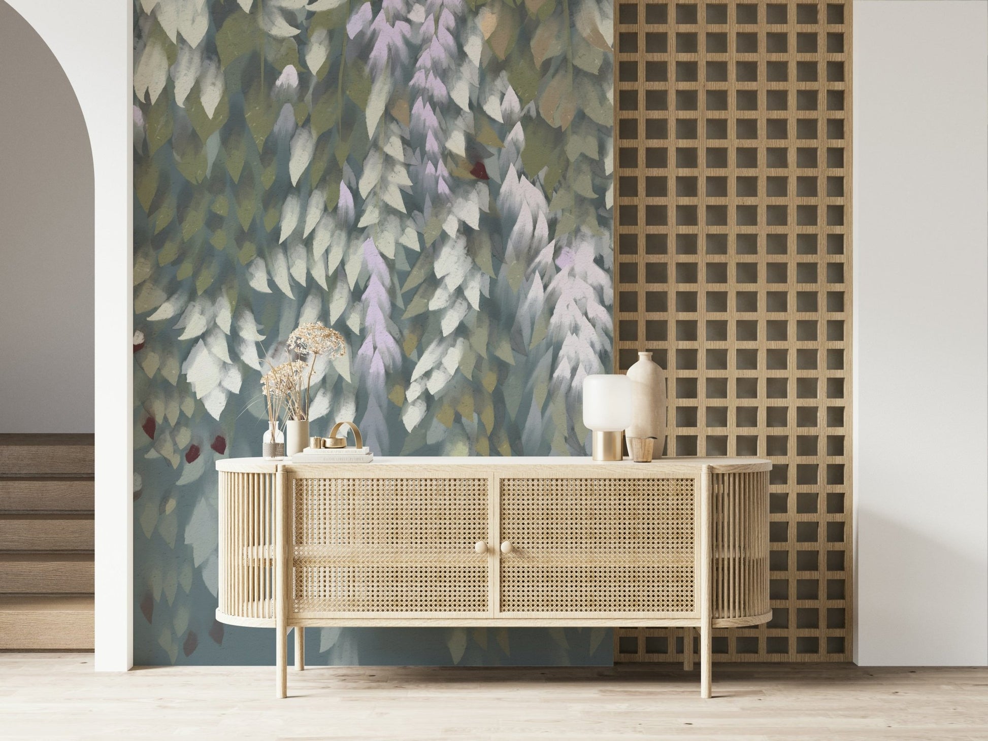 Cascading Wisteria Dream wall mural in green and lilac behind a rattan cane sideboard in an entryway