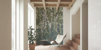Cascading Wisteria Dream wall mural of leaves on slate behind a sling chair in a sunlit hallway
