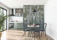 Cascading Wisteria Dream wall mural behind a terrazzo dining table and green kitchen cabinets
