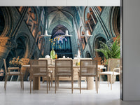 Eden's Touch Wall Mural displayed on a wide wall in a bright studio apartment.