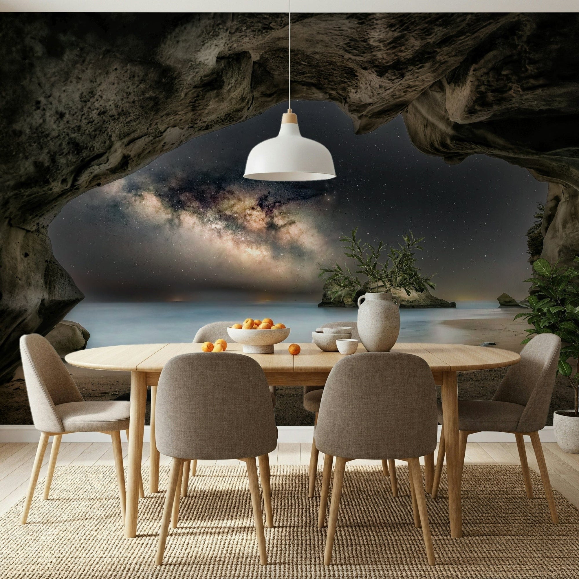 Cave Portal to Starlight wallpaper mural of a galaxy seen from a sea cave behind a wood dining table in a dining room