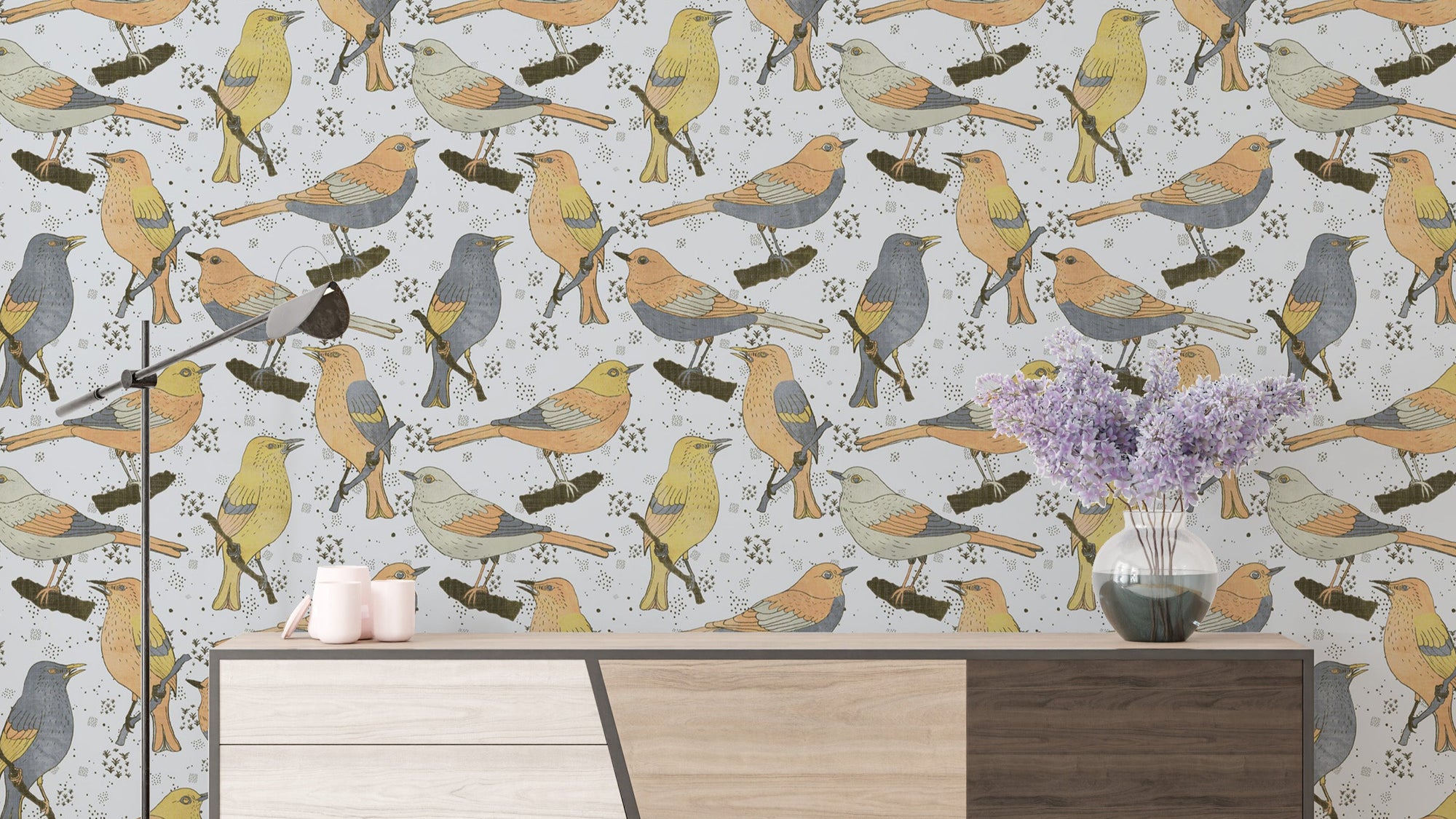 Birds Golden and Gray wallpaper showing perched songbirds above a sideboard with a lilac vase and candles