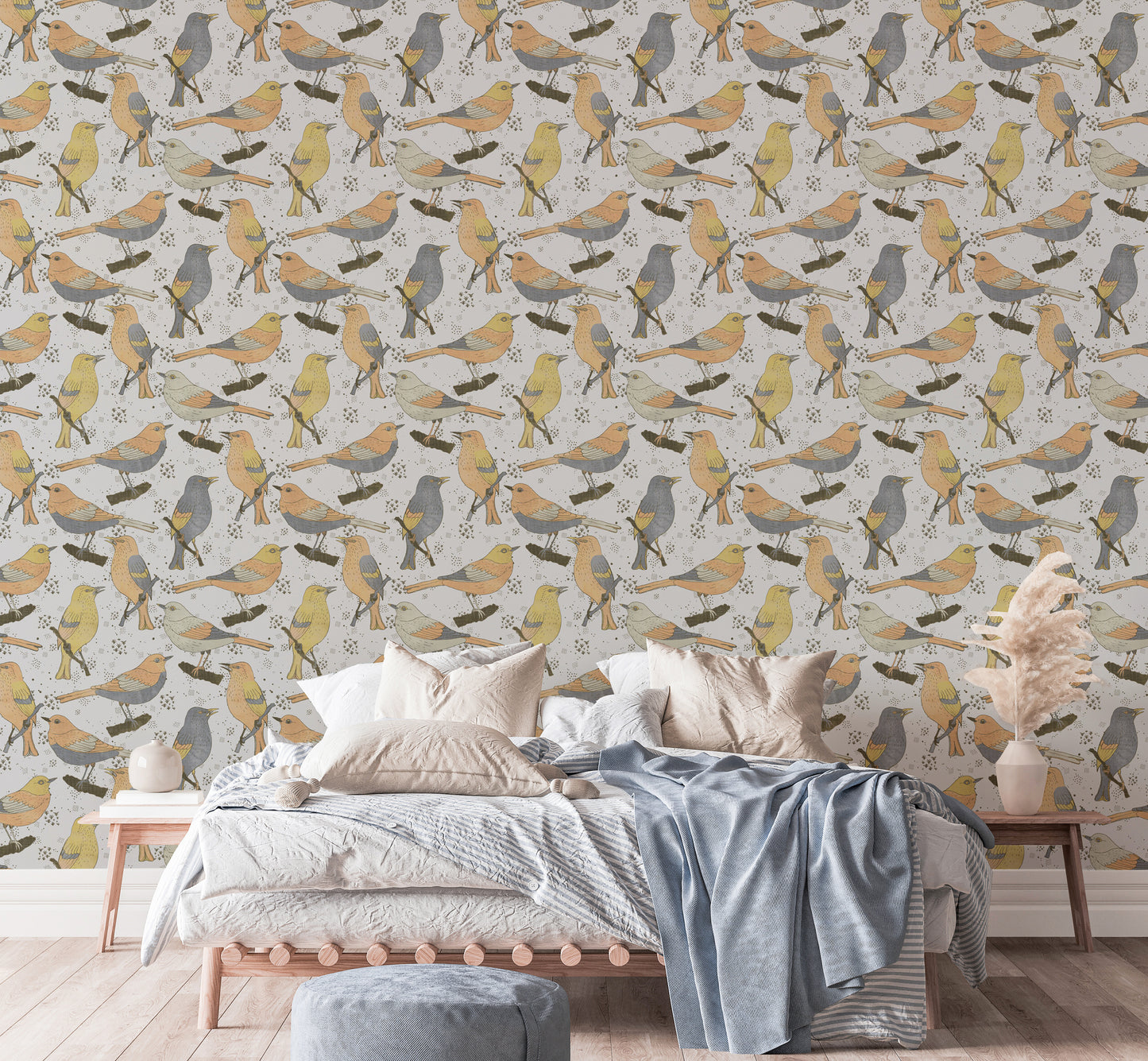 Birds Golden and Gray wallpaper behind a wood bed with white and blue bedding and pampas grass
