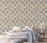 Birds Golden and Gray wallpaper behind a wood bed with white and blue bedding and pampas grass