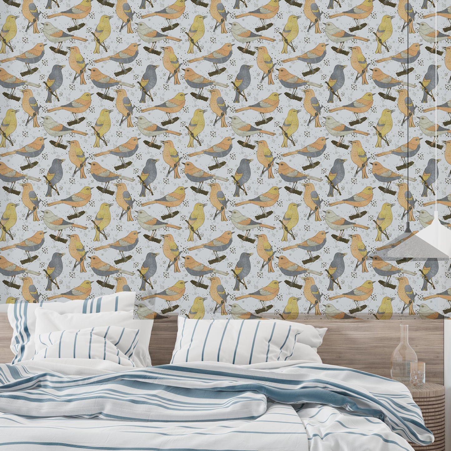 Birds Golden and Gray wallpaper behind a bed dressed in blue striped bedding in a relaxed bedroom