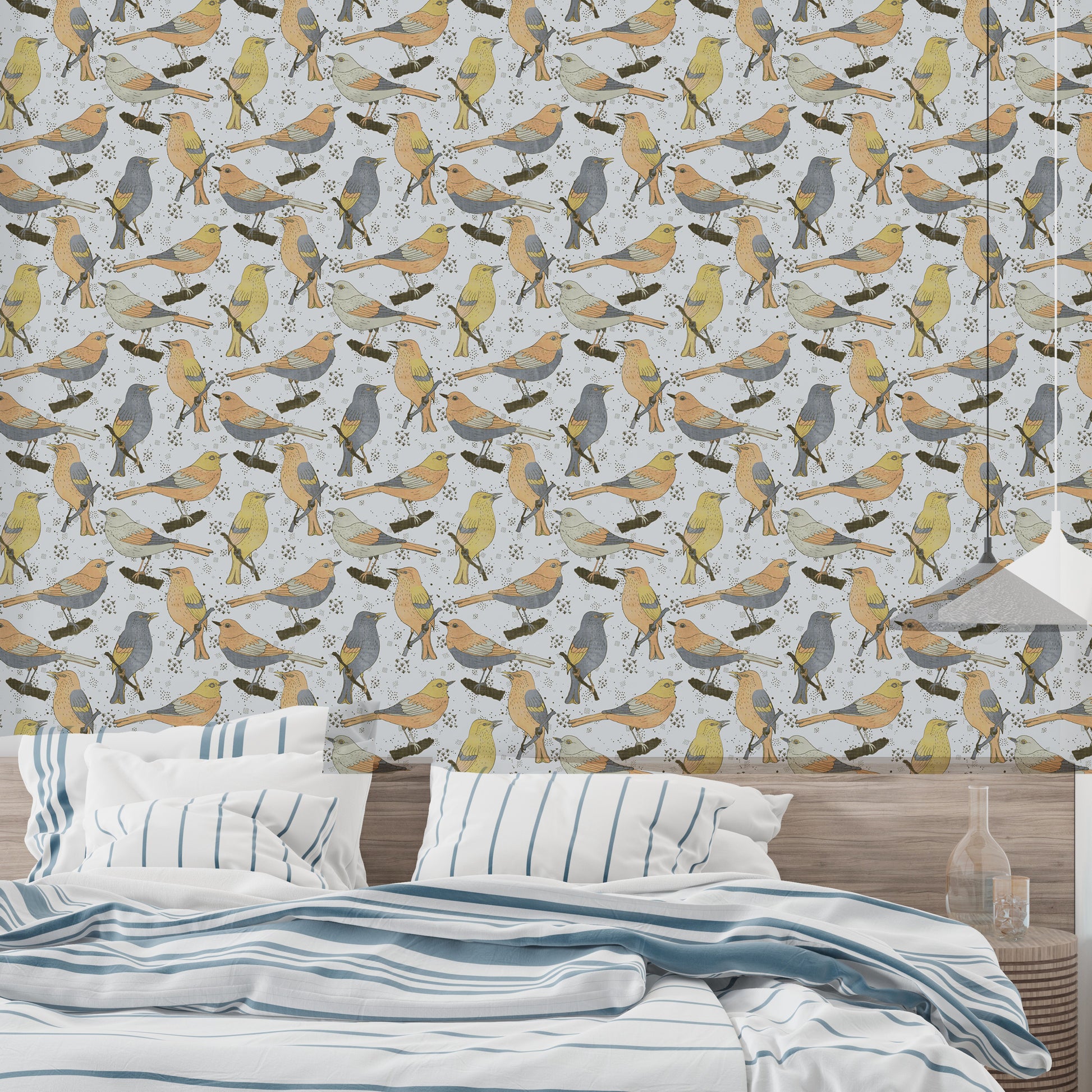 Birds Golden and Gray wallpaper behind a bed dressed in blue striped bedding in a relaxed bedroom