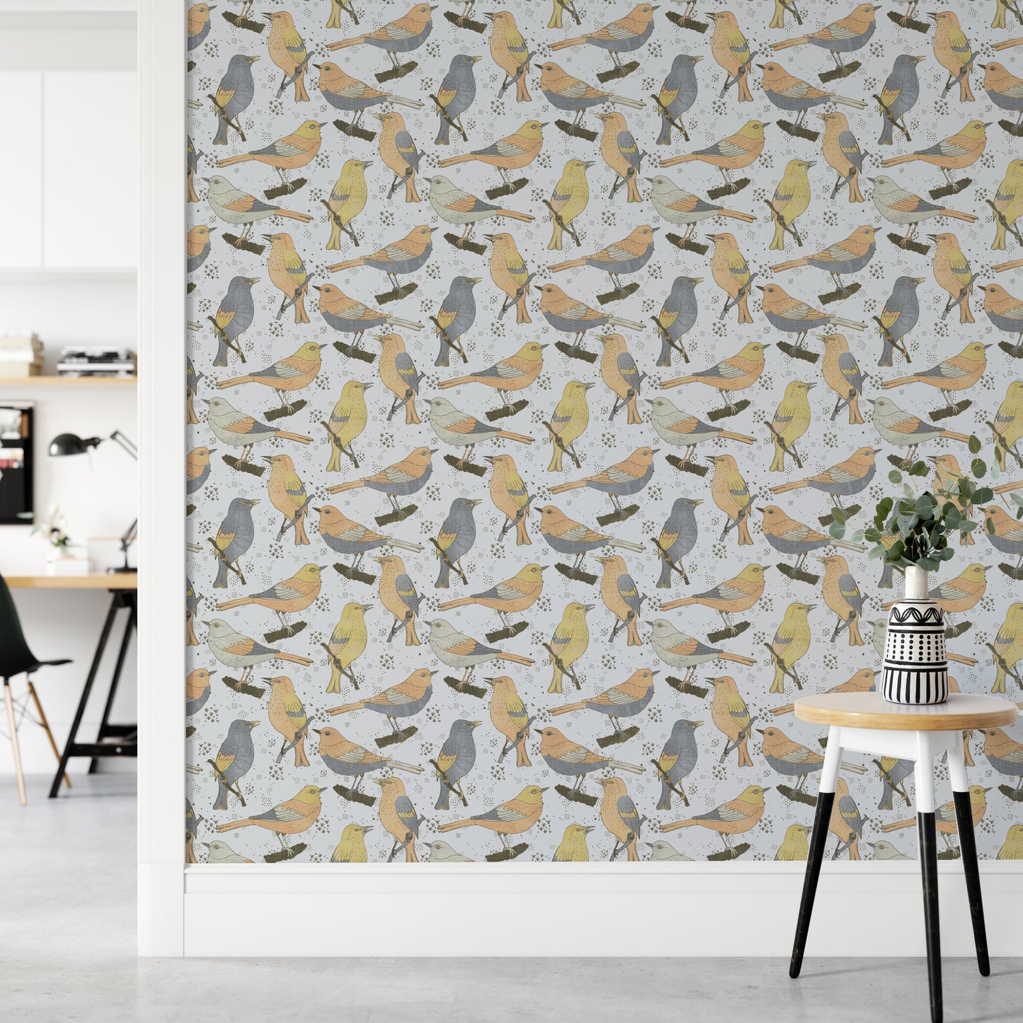 Birds Golden and Gray wallpaper in a home office with a white desk and a round table holding eucalyptus