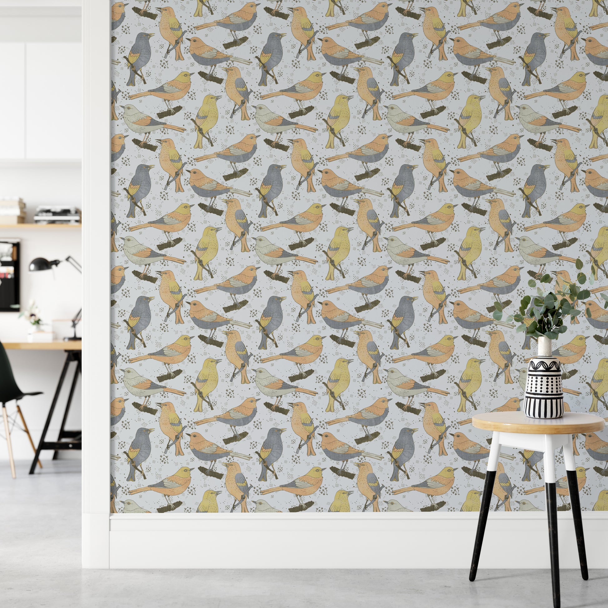 Birds Golden and Gray wallpaper in a home office with a white desk and a round table holding eucalyptus