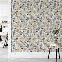 Birds Golden and Gray wallpaper in a home office with a white desk and a round table holding eucalyptus