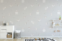 Forest Animals Gray wallpaper above a white sideboard and race-track rug in a grey kids room