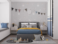 Forest Animals Gray wallpaper with bunting flags above a grey bed with mustard throw in a kids bedroom