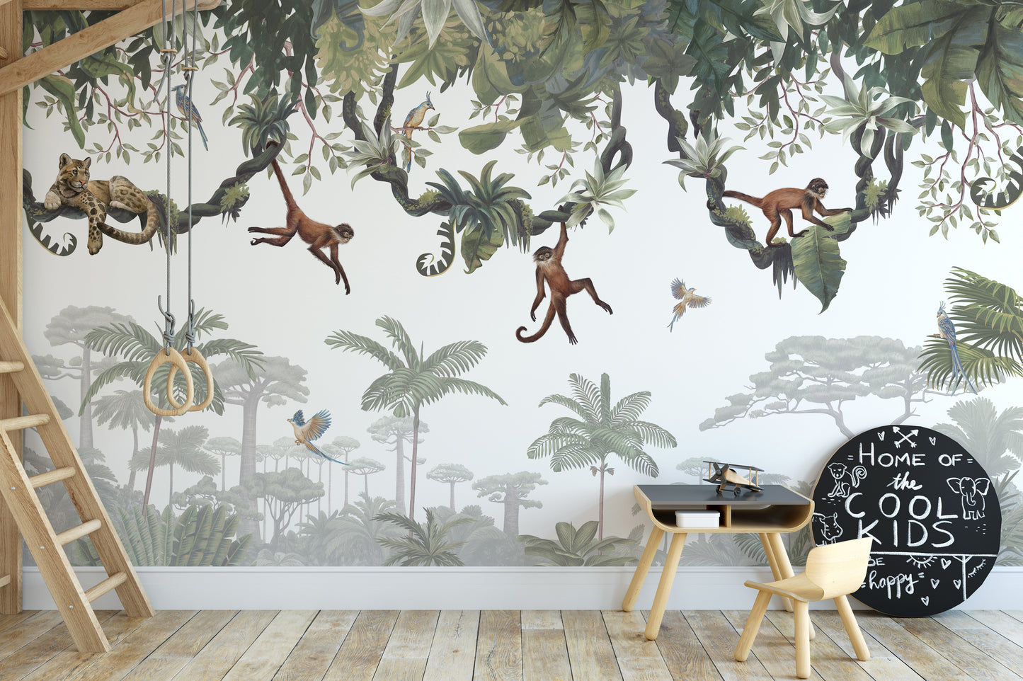 Cheeky Hanging monkeys wallpaper mural of monkeys on jungle vines behind a kids desk with chalkboard decor