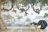 Cheeky Hanging monkeys wallpaper mural of monkeys on jungle vines behind a kids desk with chalkboard decor