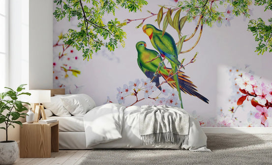 Cherry Blossom Parrots wallpaper mural with two green parrots and pink blossoms above a white bed