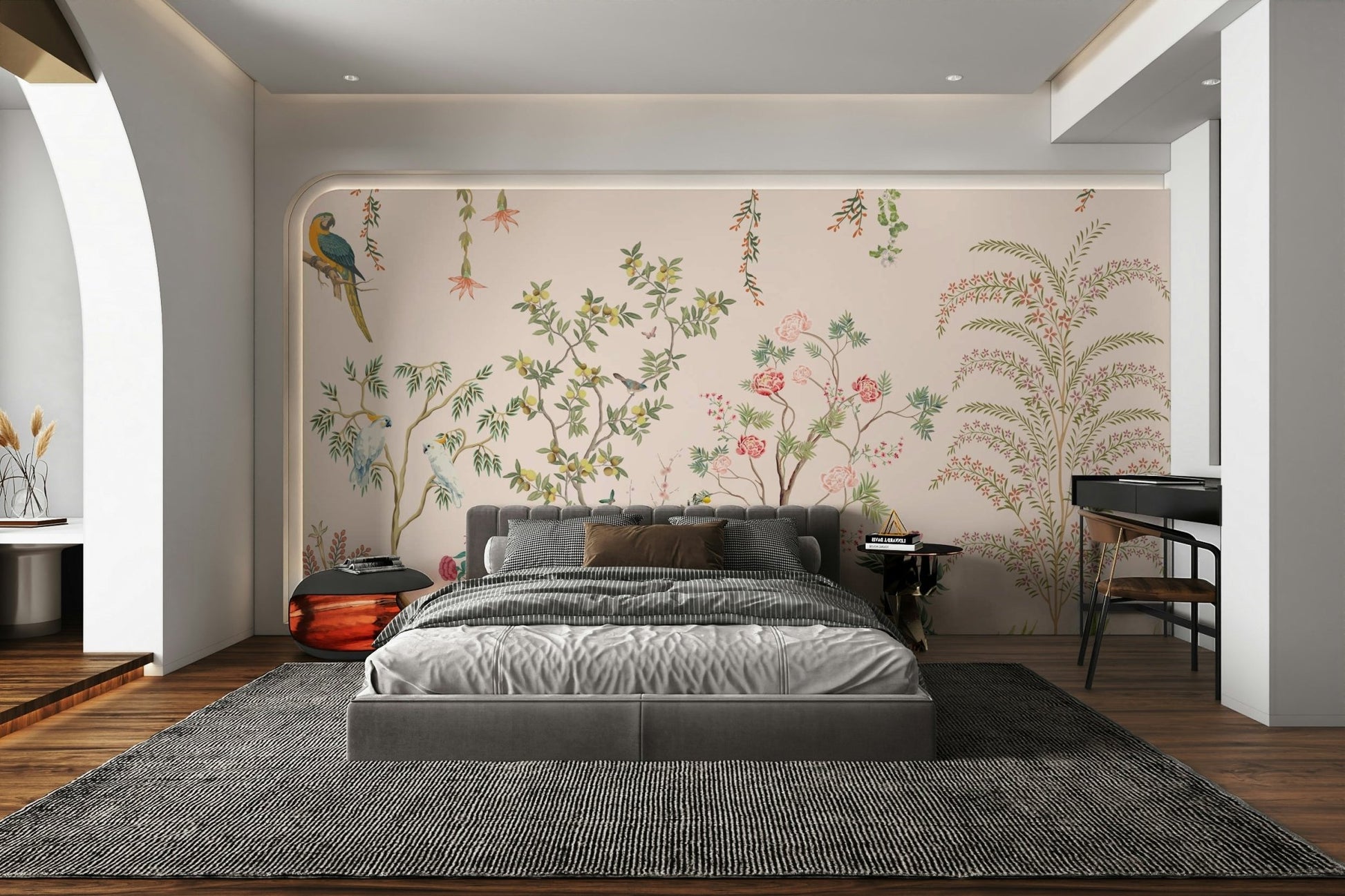 Chinoiserie Garden wallpaper mural with parrots behind a grey upholstered bed in an arched alcove bedroom