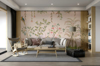 Chinoiserie Garden wallpaper mural with parrots behind a grey sofa, wooden rocking chair and tripod lamp