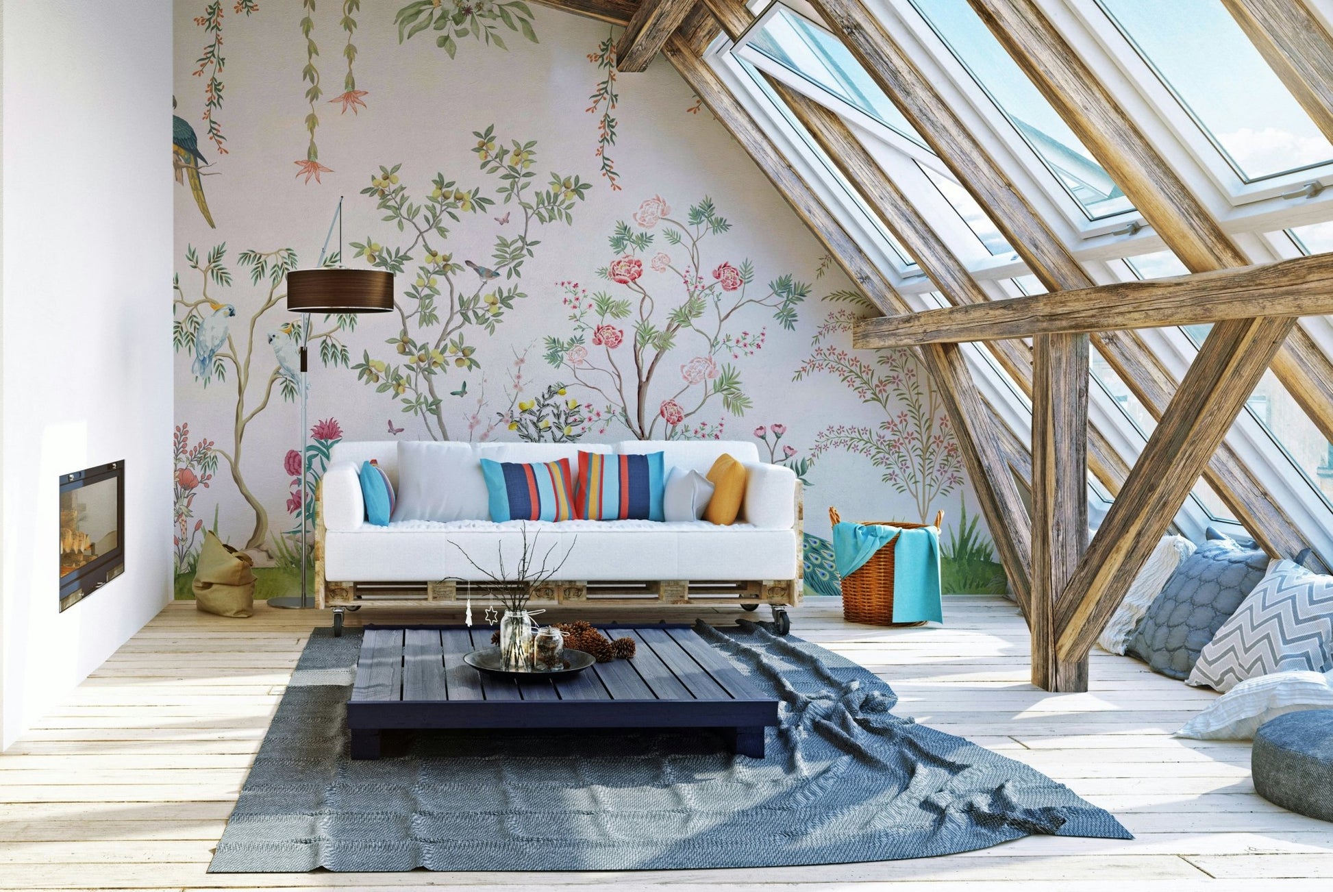 Chinoiserie Garden wallpaper mural behind a white pallet sofa with bright striped pillows in an attic loft