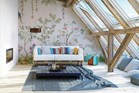 Chinoiserie Garden wallpaper mural behind a white pallet sofa with bright striped pillows in an attic loft
