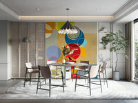 Chromatic Circles wallpaper mural with colorful circles behind a round terrazzo dining table and pleated pendant