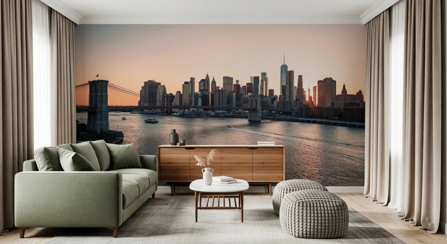 City Lights at Dawn wall mural of the city skyline at dusk behind a green sofa and wood sideboard with knit poufs