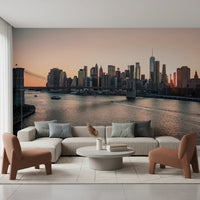 City Lights at Dawn wall mural of the skyline and bridge behind a cream sectional sofa and terracotta chairs