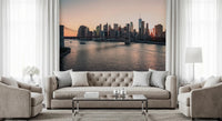 City Lights at Dawn wall mural of the skyline and bridge at sunset behind a beige tufted sofa and armchairs