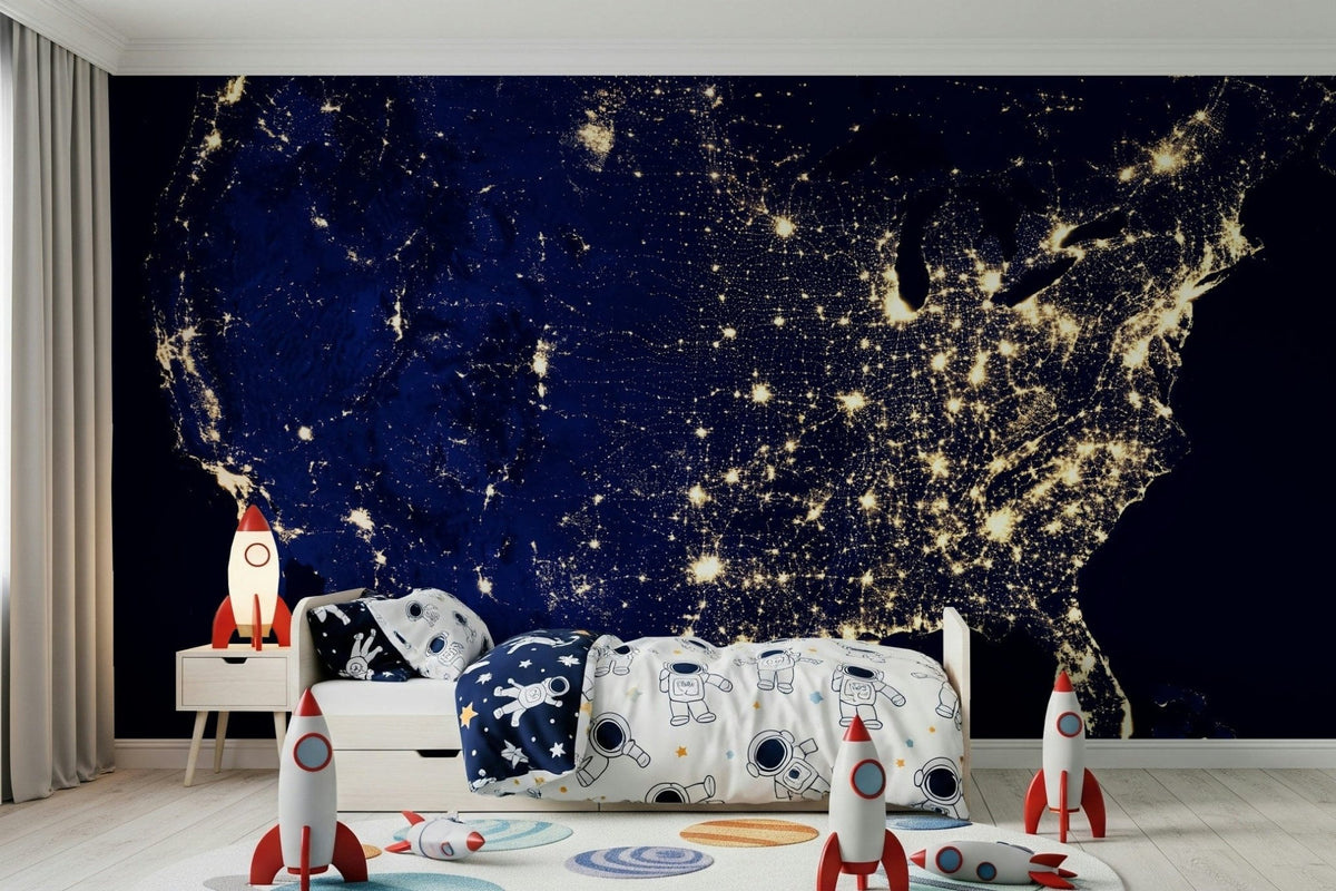 City Lights USA wallpaper mural of the glowing night-time United States behind a white kids bed with rocket toys