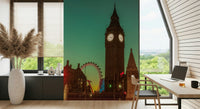 City Timepiece mural of Big Ben at dusk beside a wood home-office desk with a laptop and leafy window views