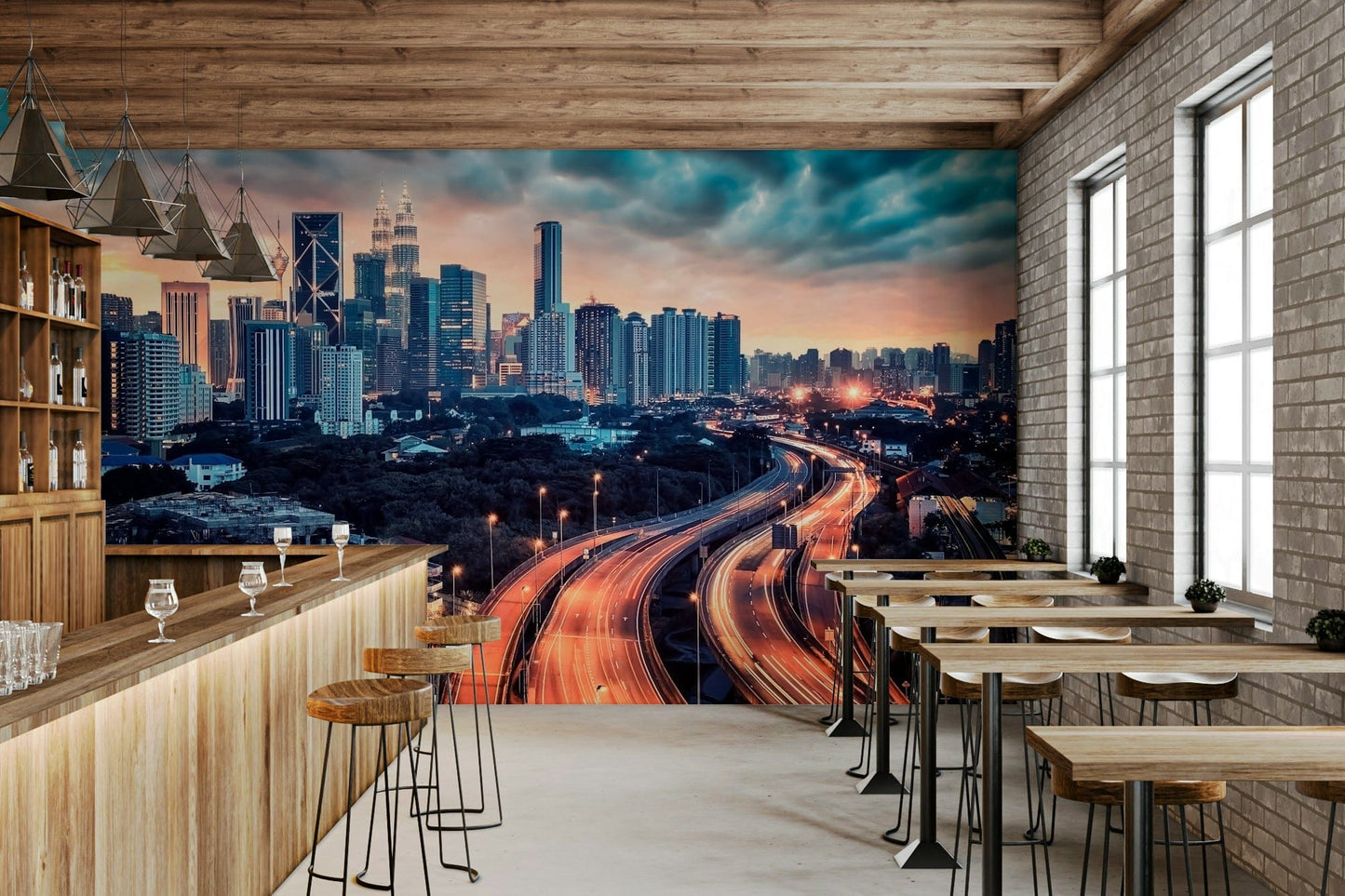 Cityscape Dawn wallpaper mural of a glowing city skyline along a wood bar counter with stools in a cafe