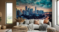 Cityscape Dawn wallpaper mural of dramatic clouds over the city behind a white sofa with terracotta cushions