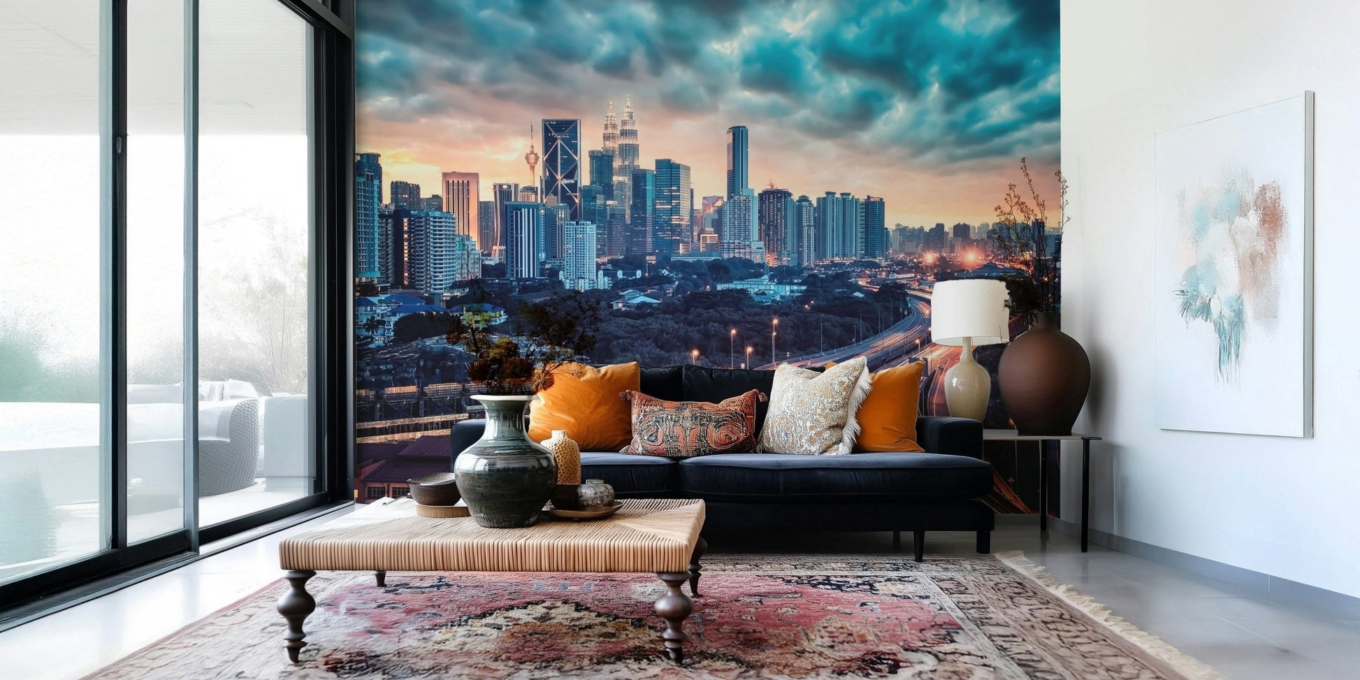 Cityscape Dawn wallpaper mural showing the orange sunset skyline above a navy sofa with amber cushions in a living room