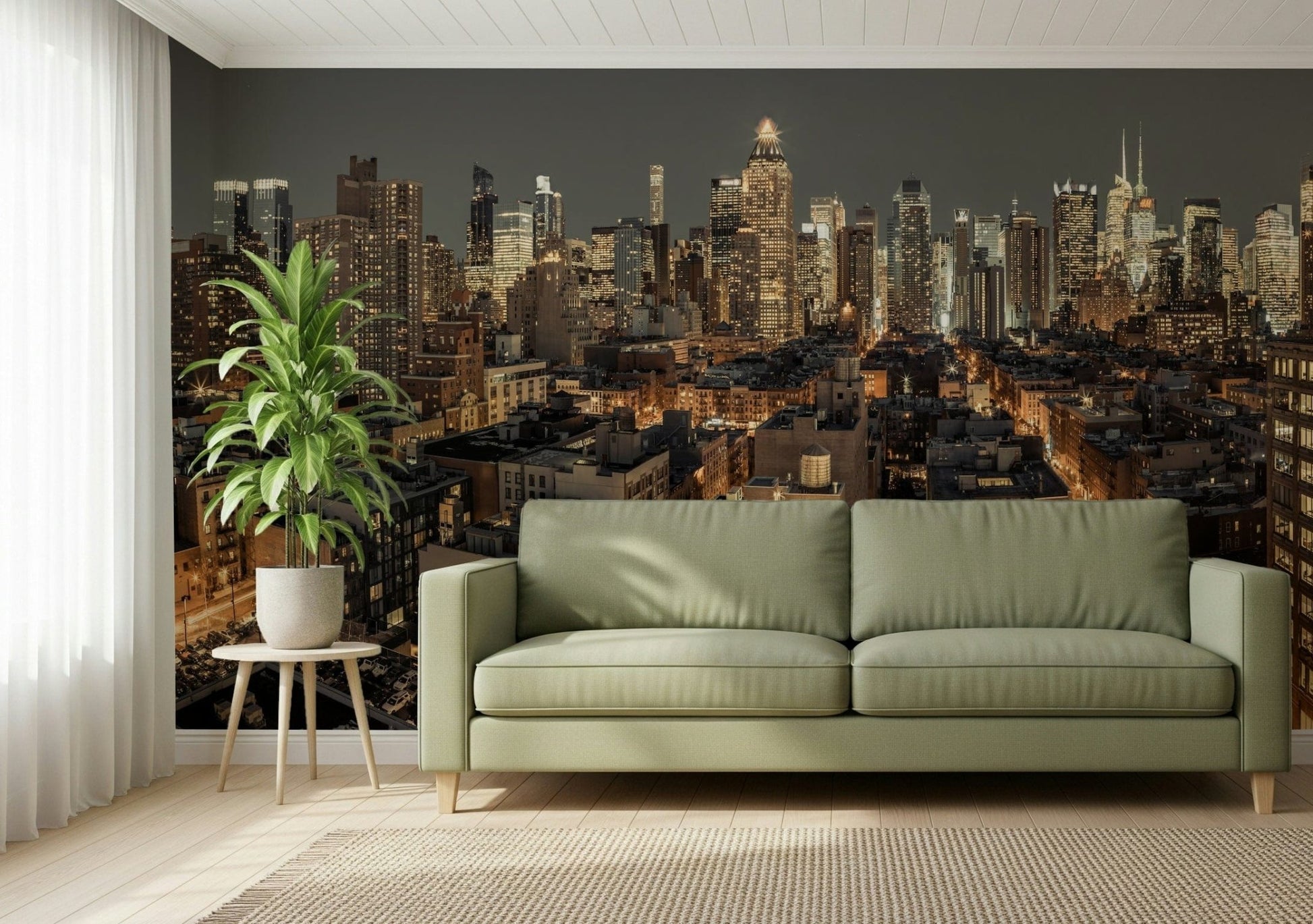 Cityscape Twilight wallpaper mural of a city skyline behind a sage green sofa and potted plant in a living room