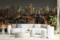 Cityscape Twilight wallpaper mural of a city skyline behind a white curved boucle sofa in a living room