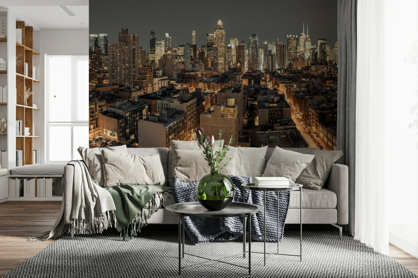 Cityscape Twilight wallpaper mural of a city skyline behind a grey sectional with throws in a living room