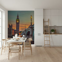 Clock tower wallpaper mural of Big Ben at sunset in a kitchen diner with a marble table and wishbone chairs
