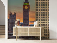 Clock tower wallpaper mural close-up of Big Ben's lit clock above a cane sideboard in an entryway